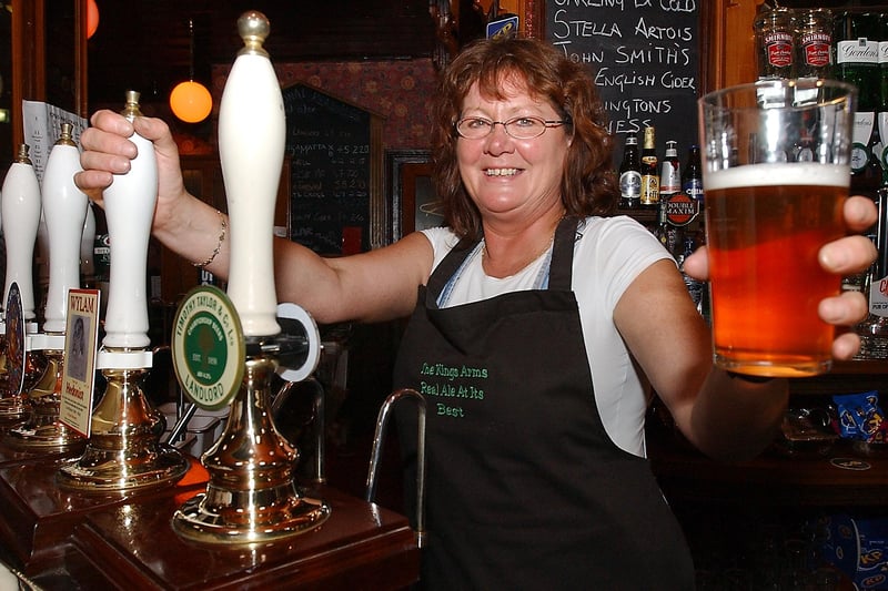Barmaid Lucy Young raises a toast to the pub after it won the Camra North East Pub of the Year Award in September 2006.