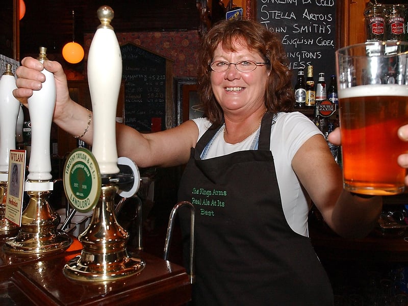 Barmaid Lucy Young raises a toast to the pub after it won the Camra North East Pub of the Year Award in September 2006.