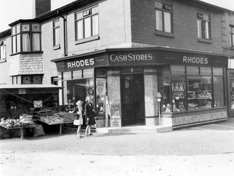 Rhodes, grocery store is on the corner of Vesper Road with Woodhall Drive in September 1937. A stall selling fresh produce has been set up on the pavement. The City Engineer has marked this on the photograph with a red cross implying that permission has not been granted.