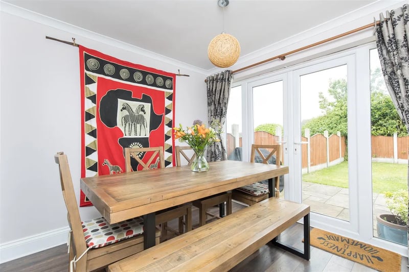The dining area sits to the rear of the property and has French doors onto the rear garden.