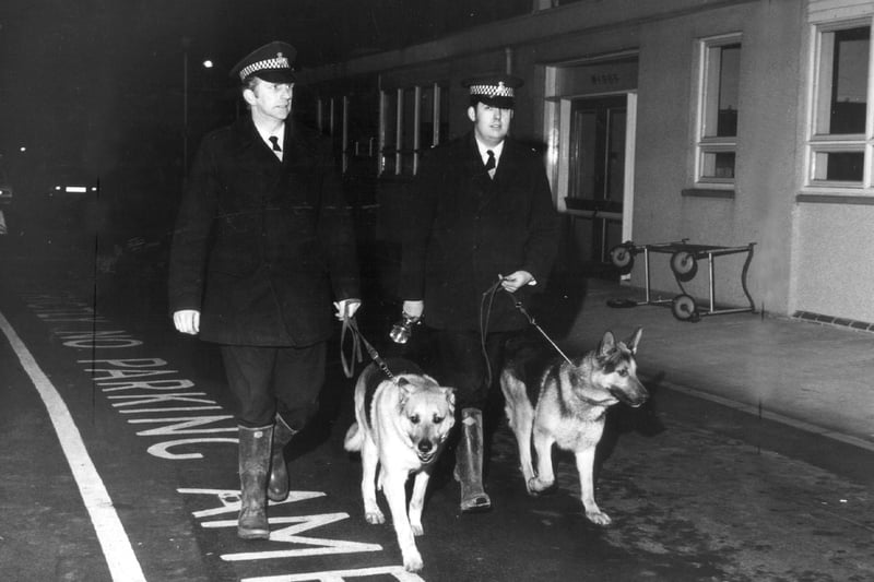 Dog handlers patrolled the hospital area after the horrific early morning killings in 1972