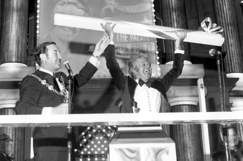 Summer show star Danny la Rue received a giant stick of rock after switiching on the Illuminations in 1972. The Talbot Square crowd also heard Danny talk to Concorde pilot Brian Trubshaw, recorded earlier in the day as the jet swept over the Fylde