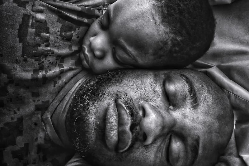 Photographer: "While I slept, my little boy came to lie beside me and slept off. He had awakened me when he came in, and typically I couldn't get back to my nap. But my eyes were still heavy, and my phone was near me. I had an idea. I took the shot in the position we slept off in. I made me think how he came from me, and still was, as it looks in the image, very much attached to me and will always have my heart. This remains one of my all-time favourite images."