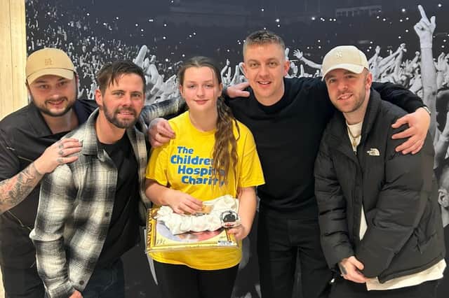 Leah pictured with the Reytons who donated a number of items for her to raffle and keep.