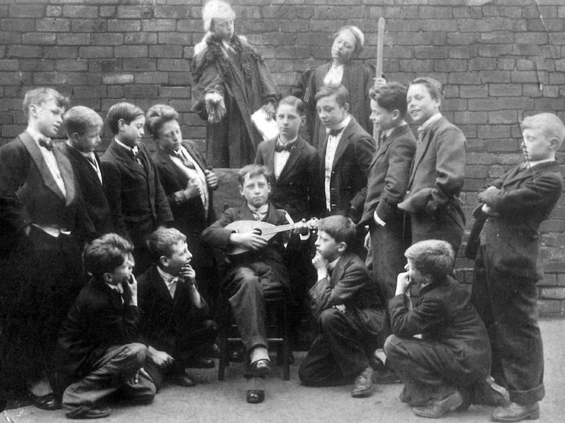 Pupils of St. Luke's School taking part in a production of Gilbert and Sullivan's comic opera Trial by Jury in April 1926. Standing fourth from the right is Jim Wheeler but no other names are known.