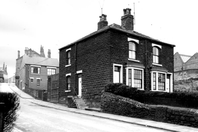 Pickering Street looking in the direction of Armley Road. The house on the hill is number 27 and is only one storey at the front but is built on two storeys and possibly three at the rear. A pair of stone built semi-detached properties with bay windows at the front are numbered left and right 37 and 39 respectively. Bankfield Mills can be seen far right. Pictured in February 1964.