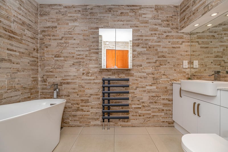 One of the great features about the principal bedroom is the refitted four-piece en suite bathroom with tiled floor and wall coverings walk in shower and a freestanding bath.
