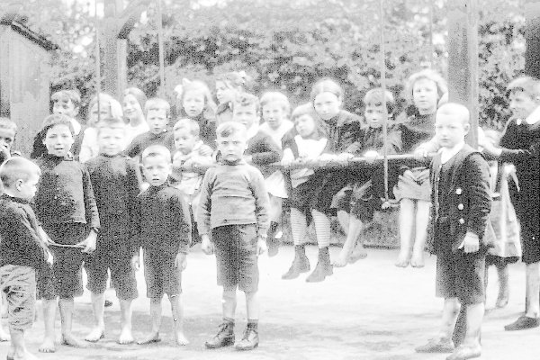Children pose for a picture down the play park at Glasgow Green