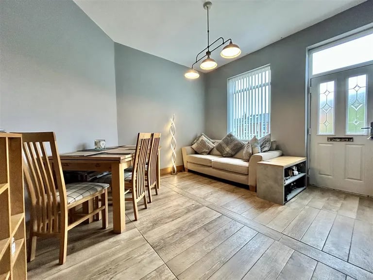 This large and bright room also has a door to the block paved rear garden.