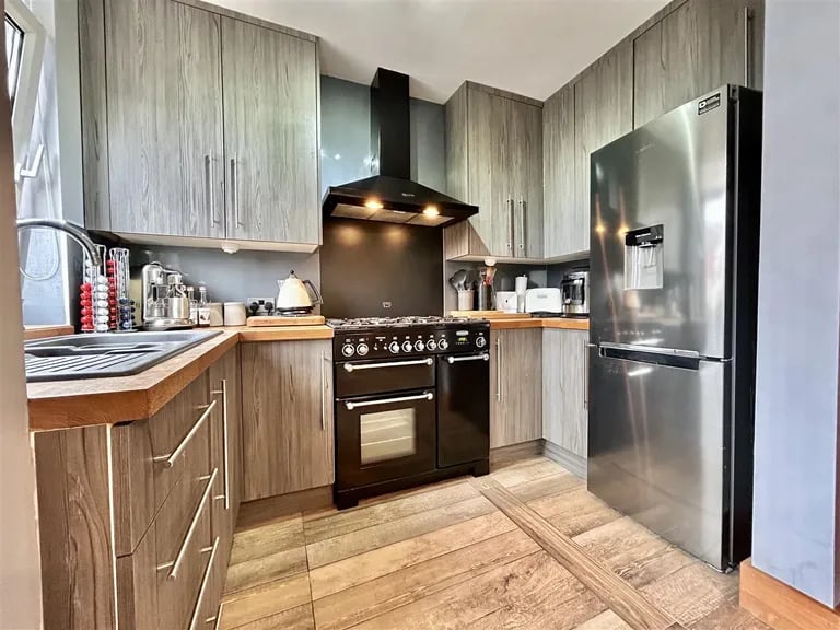 Next to the dining room is a separate modern kitchen.