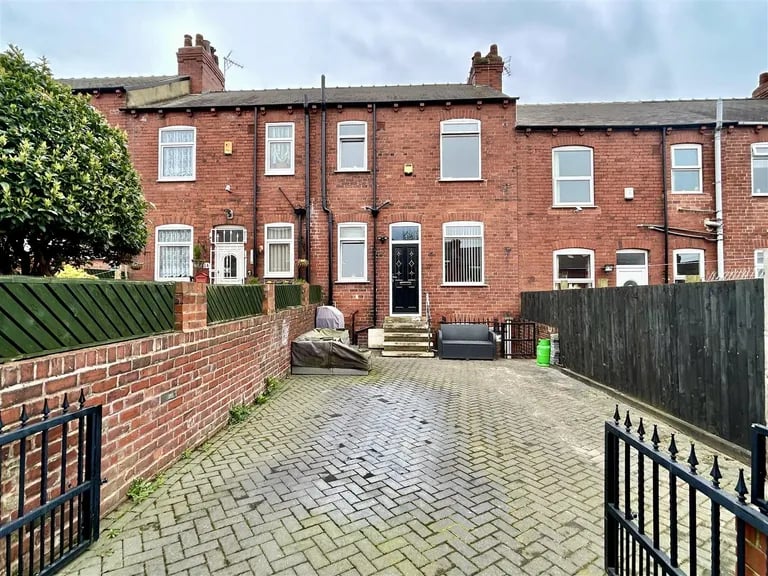 To the rear is a large semi-enclosed paved garden with iron gates which can double as a driveway for off street parking.