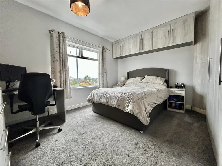On the first floor is a large double bedroom.