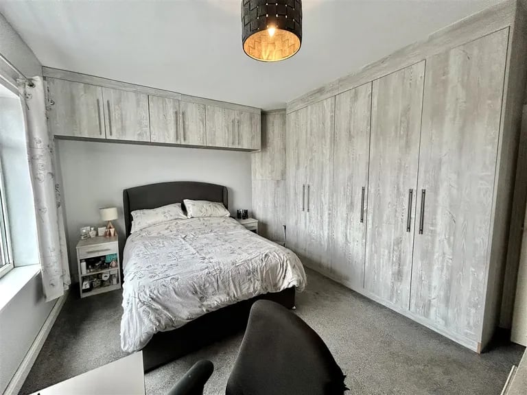 It is fitted with lots of storage space both in the form of wardrobes and overhead cupboards.