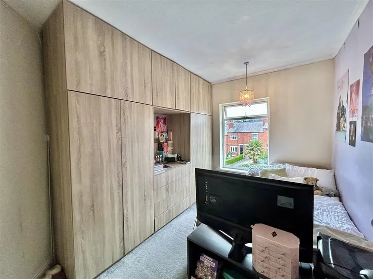 This room also utilises the space to the fullest with fitted storage.