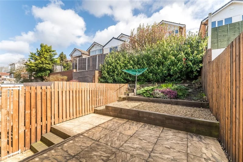 The split level garden benefits from a generous patio area and ascending terraces.