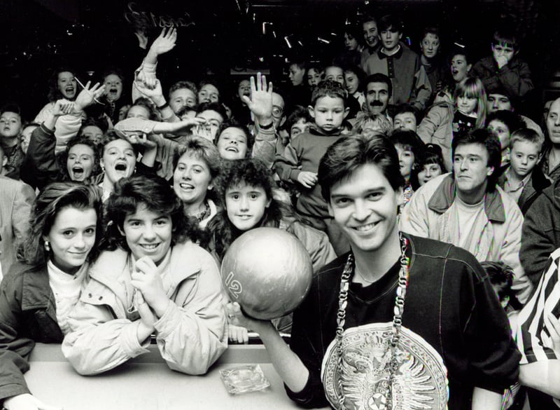 A young Phillip Schofield is surrounded by fans at the opening of Sheffield Superbowl in December 1989