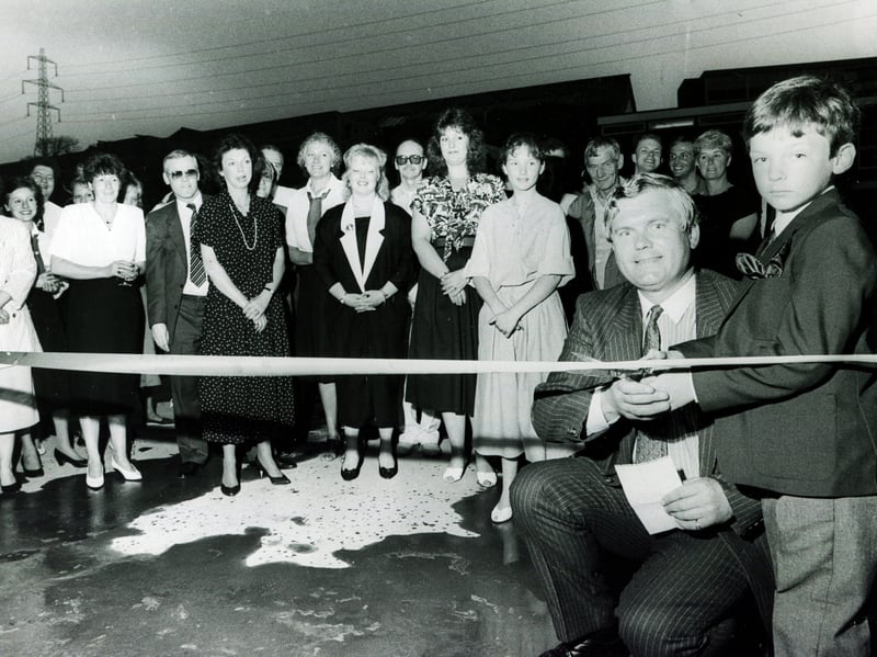 Tom Sugg cuts the ribbon to open the new Sugg Warehouse with the help of son Tim, in May 1989