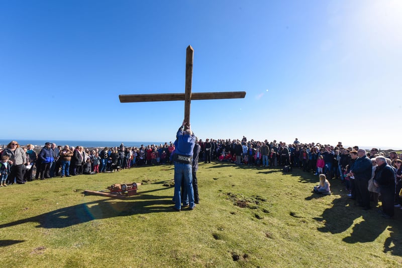The raising of the cross on Tunstall Hills in 2016.