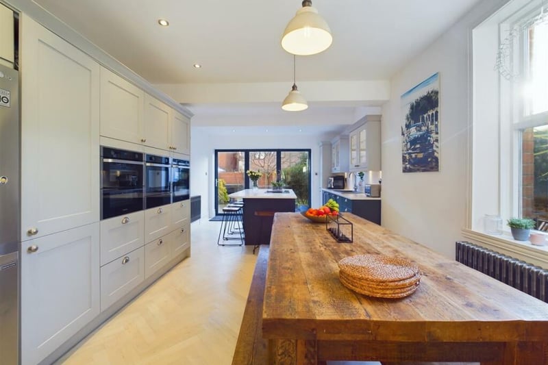 At the rear of the property is a well-lit open plan kitchen and dining area.