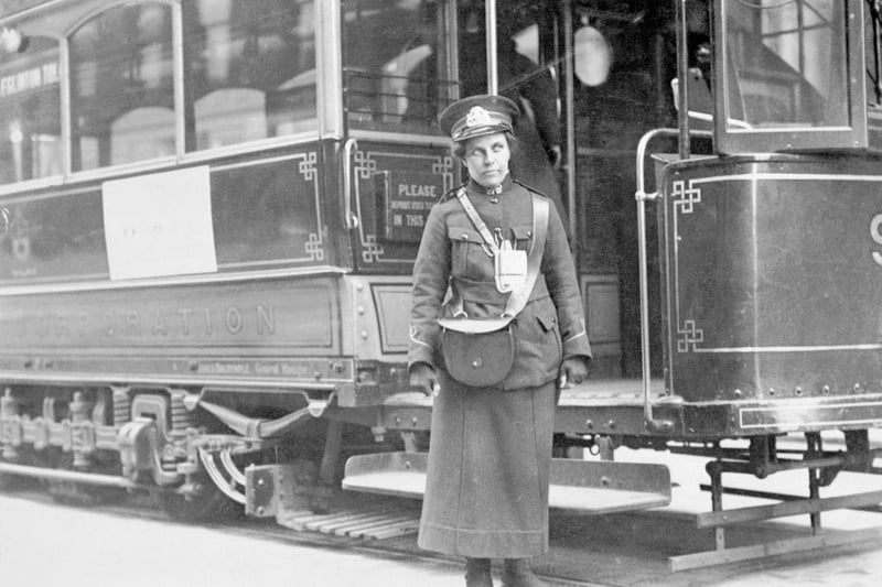 A tram conductor in her winter uniform, possibly in Glasgow, 1915. Glasgow pioneered the use of female operatives on its public transport system during the war. Male colleagues opposed their presence, declaring such work to be 'unwomanly', physically demanding and morally dangerous. 