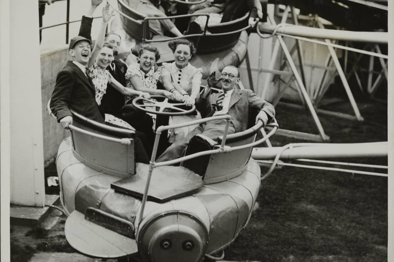 4,500 employees of the Raleigh Cycle Company arrived in Blackpool from Nottingham, for a days outing. A happy party on the 'Bug' in the Pleasure Beach, Blackpool 