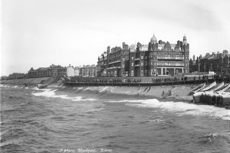 Hotel Metropole, Blackpool, Lancashire, 1890-1910. The north shore at Blackpool with people walking along the promenade by the Victorian Hotel Metropole. Beach huts have been pulled closer to the railings out of the way of the rough sea