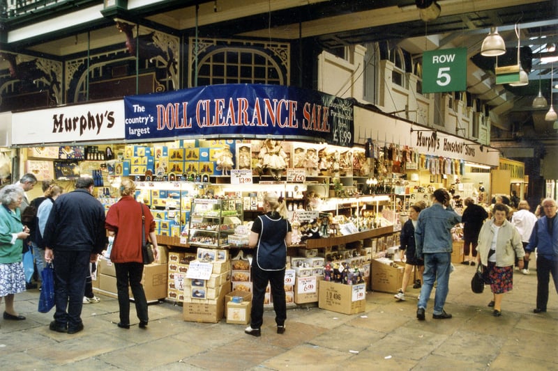 Row 5 of Kirkgate Market Hall interior, showing shoppers and Murphy's Household store on the corner in September 1999.