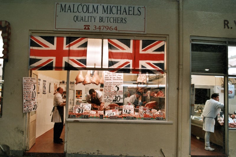 Malcolm Michaels shop on Butchers Row. There are two Union flags in the window above the display of meat. Pictured in September 1999.