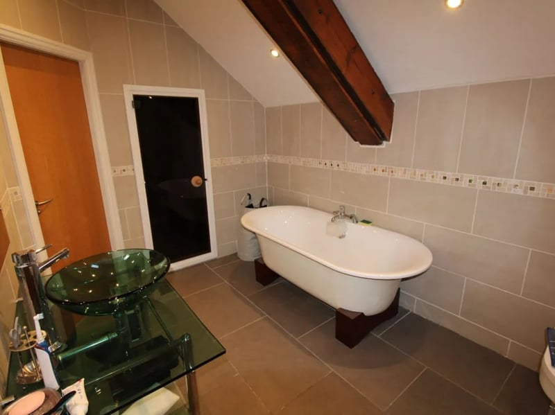 The family bathroom is fitted with a bath, sink and toilet.
