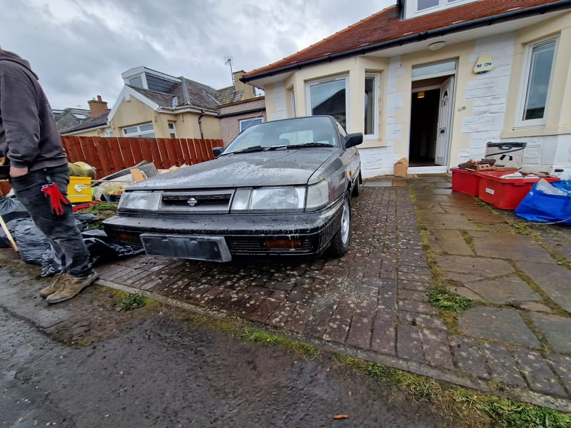 One of the vintage cars, pictured on Thursday morning ahead of it being removed, as Peatville Terrace was brought back to 2024.