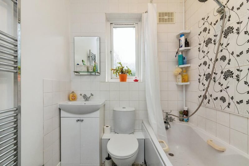 The family bathroom is slightly larger than average and comprises of a bath tub, low flush WC and wash hand basin.