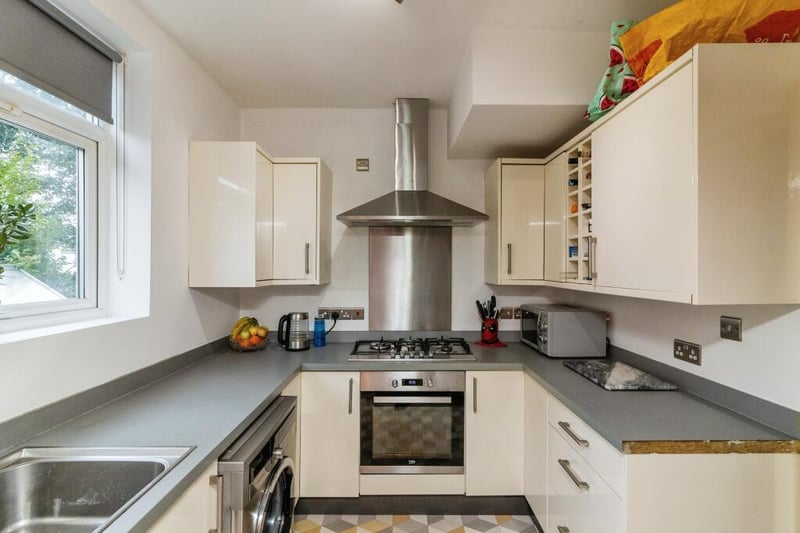 The fitted kitchen has a range of wall, drawer and base units with space for kitchen appliances.