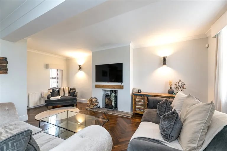 The spacious living room with attractive solid wood floor greets you as you enter via the entry porch.