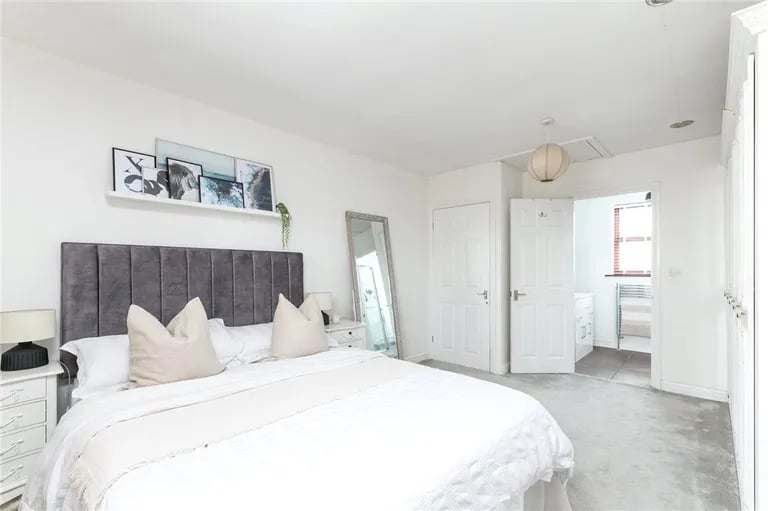 On the first floor is the large master bedroom with built-in wardrobes and en-suite.