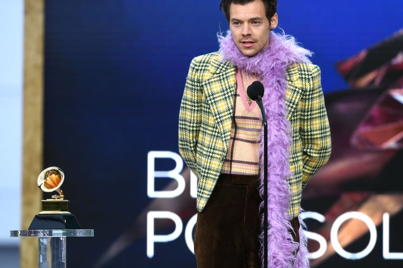 Yes I know it is Harry Styles gain, but oh my, this Gucci look that he wore to the GRAMMY Awards in 2021 has to be written about. the yellow checked jacket with the v neck jumper and feather boa are definitely OTT, but I love the ensemble