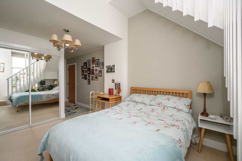The impressive principal bedroom is a generous double room with ample built-in wardrobes and storage space and has an en-suite shower room with modern white suite.