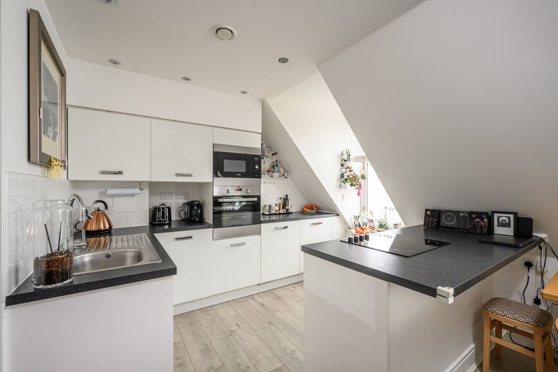 The kitchen area is fitted with an excellent range of modern wall and base units with integrated appliances including fridge, freezer, dishwasher, oven, microwave and hob.
