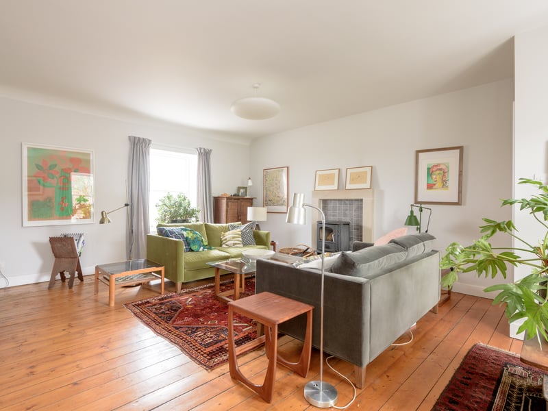Interior: A welcoming entrance hall leads to a contemporary open-plan kitchen-dining room, which boasts an Aga range and double doors to access the property’s attractive garden. The lounge can be found on the home’s middle level and there is a double bedroom on each of its three floors.