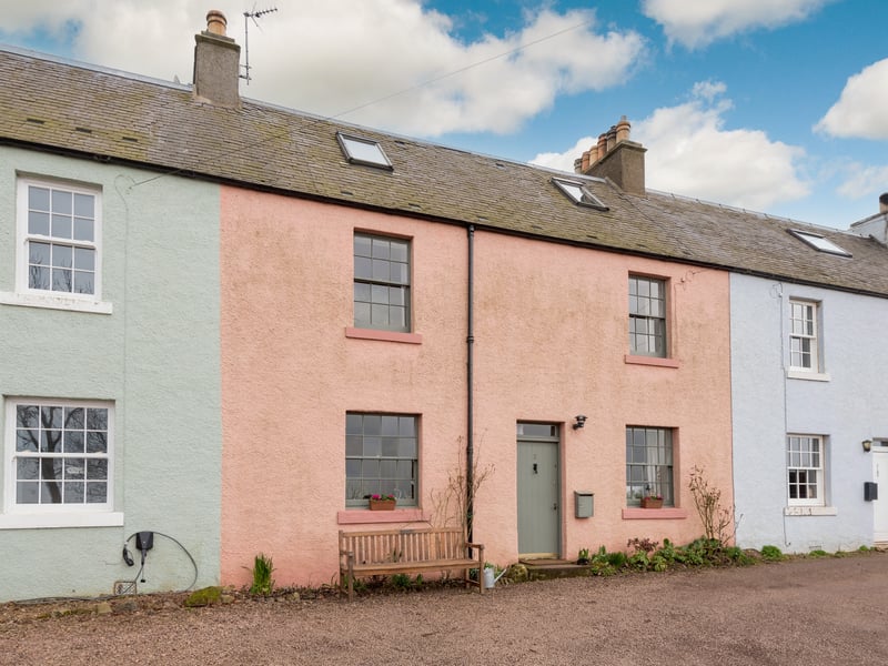 What is it? A charming period home rendered in salmon pink with three bedrooms and a modern interior.