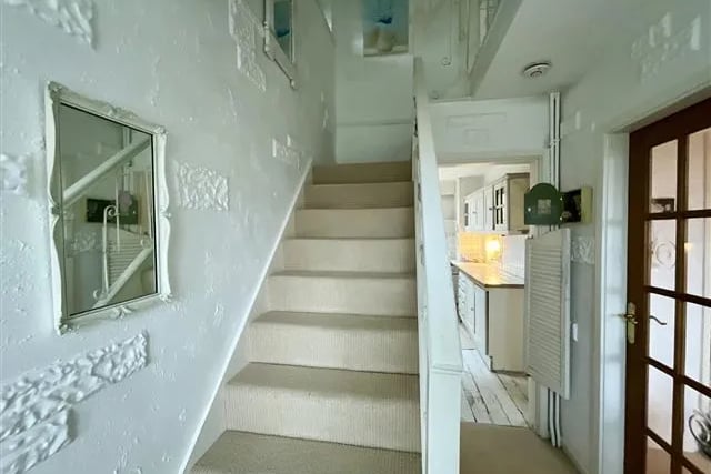 The main staircase could use some love. But this picture shows how the ground floor is interconnected room to room. Being able to "alk in a circle" in your ground floor rooms creates a great sense of space and freedom that is hard to come by in most new build homes at this price.