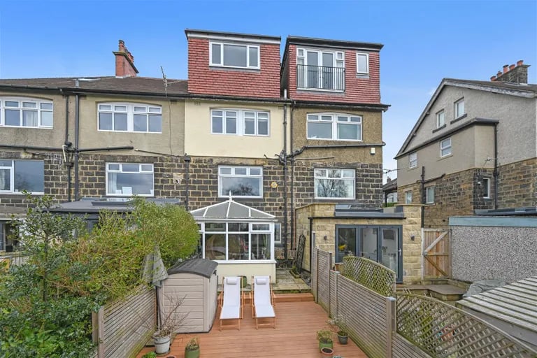 A colourful terrace set over four floors is on the market.