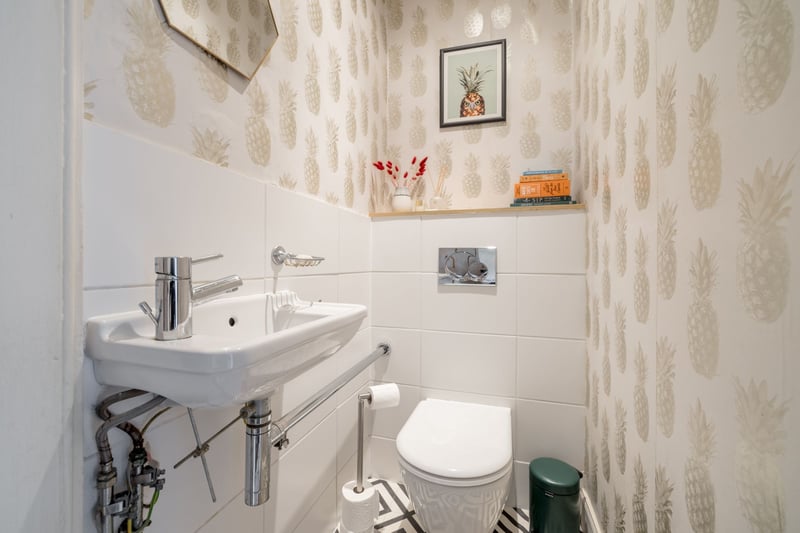 The separate wc with wall hung wc and sink. The property also benefits from Upvc double glazed sash and case style windows, as well as Herringbone and stripped wood flooring and stripped doors.