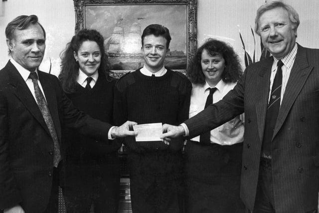 A cheque presentation in 1992 as Gareth Jones, left, manager of Esso Petroleum hands a cheque to John Wells, principal of South Tyneside College, watched by marine cadets from Esso International Shipping. But who can tell us more?
