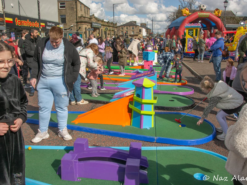 People flocked to have a go at the mini golf holes set up at the event.