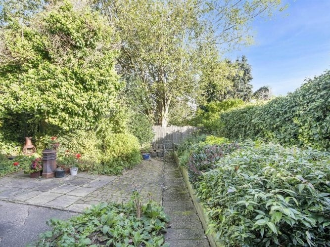 To the rear, a beautiful, green private garden presents an excellent space to relax.