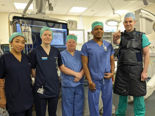 Dr Nigel Lewis with the specialist interventional cardiology team who are delivering treatment to Emily.