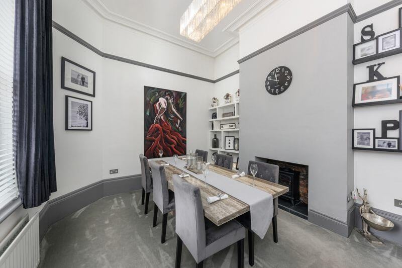 The formal dining area is ideal for hosting dinner parties.