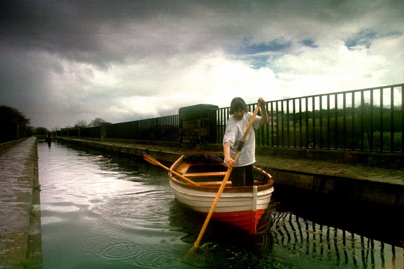 Members of the Edinburgh  Canal Society negotiated the narrow Aquaduct at Slateford on there Annual Dinghy Dawdle in April, 1998.The dawdle began at Harrison Park and finished at Kingsknowe where the canal ended at the time.
