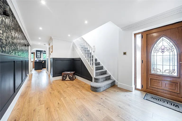 Enter the four bedroom dormer bungalow via the stunning entry door to be greeted by a grand hallway.