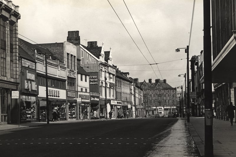 A 1965 view of Northumberland Street looking towards the Haymarket. A number of shops are pictured on the left of the photo including Freeman Hardy and Willis; Dolcis; Weston's and Tru-Form. the Tatler cinema is pictured at the top of the street.